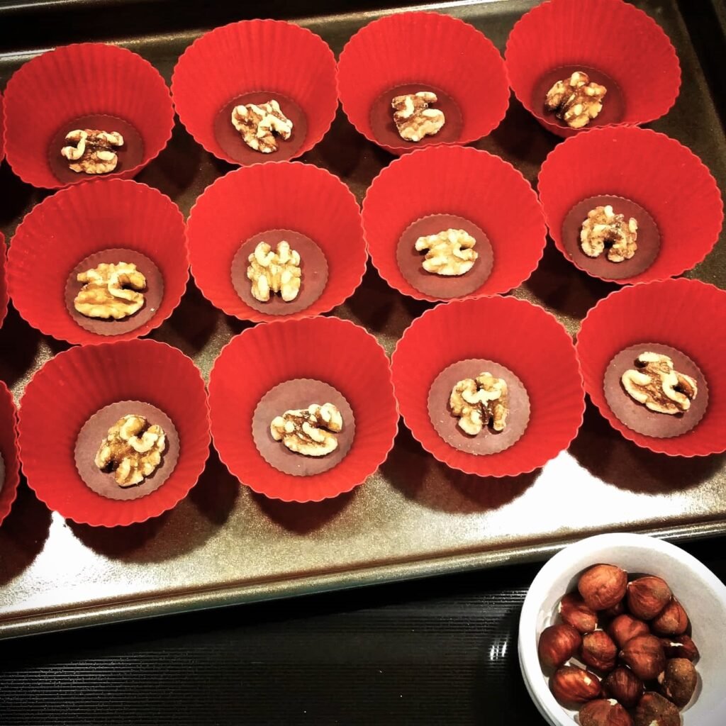 Cottage in the Sky: Set a half walnut into the bottom of each silicone baking cup.